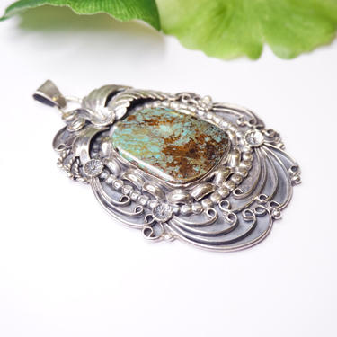 Large vintage silver 2024 and turquoise pendant.