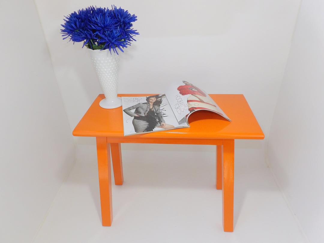 Elegant Orange Occasional Table Enhances Modern Living Rooms