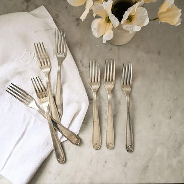 eclectic set of vintage french forks and spoons