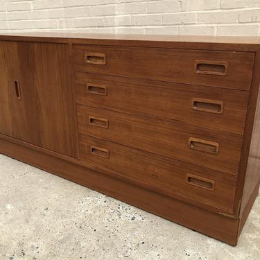 Plinth base teak credenza