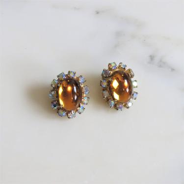 Vintage 1960s clip on earrings, aurora borealis rhinestones, amber glass cabochons 