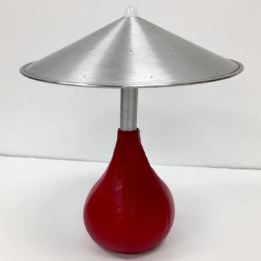 Pablo Pardo Piccola table lamp with spun aluminum shade and red leather bean bag base 