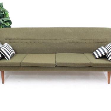 Mid Century Modern Danish sofa with wood arm rests 