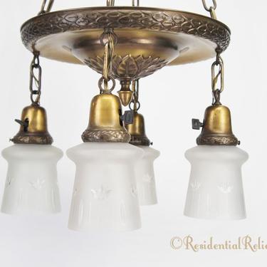 Embossed 4-light brass chandelier with engraved glass shades, circa 1910s