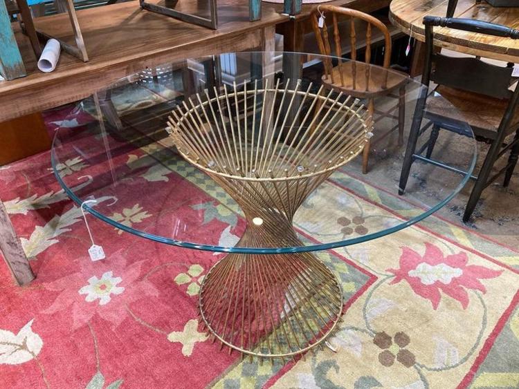 Gold metal based glass top table.  42” x 29”