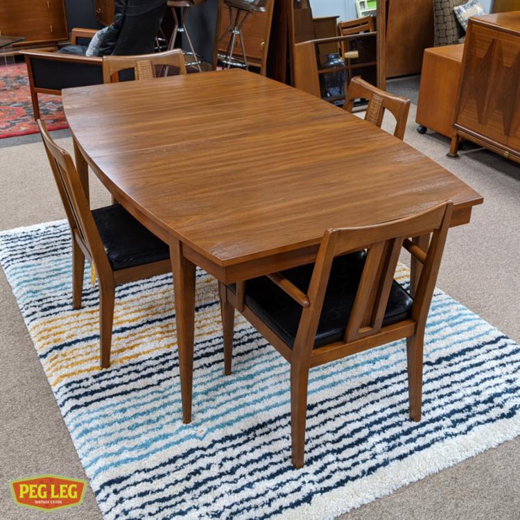 MidCentury Modern walnut boatshaped dining table with dropin