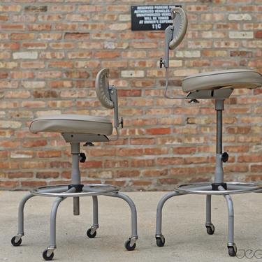 pair of amazingly adjustable desk- or bar-height seating: grey vinyl vintage industrial rolling drafting stools by Cramer, free shipping 
