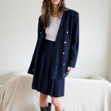 navy pleated skirt suit with long line double breasted blazer 
