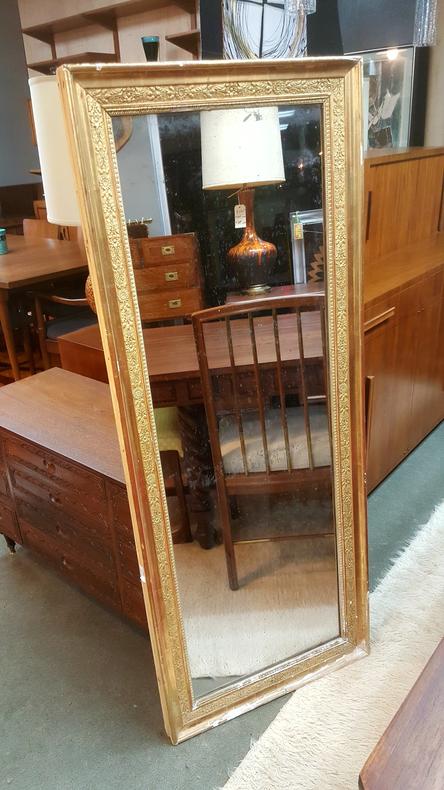 Antique full-length gilded mirror