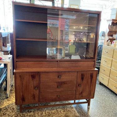 Mid century glass front cabinet. 54.25” x 18.5” x 66.25”