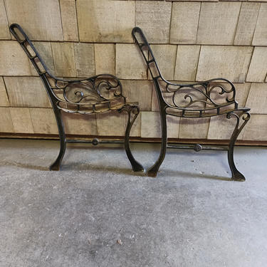 A pair of garden/park bench metal legs/arm rest