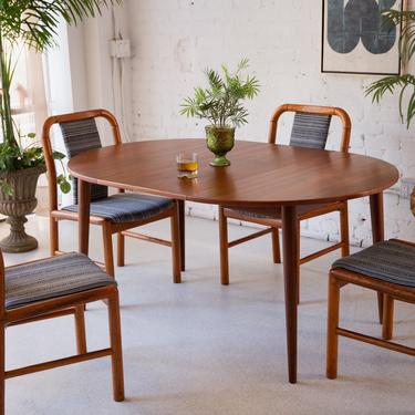 Round to Oval Dining Table with Leaf