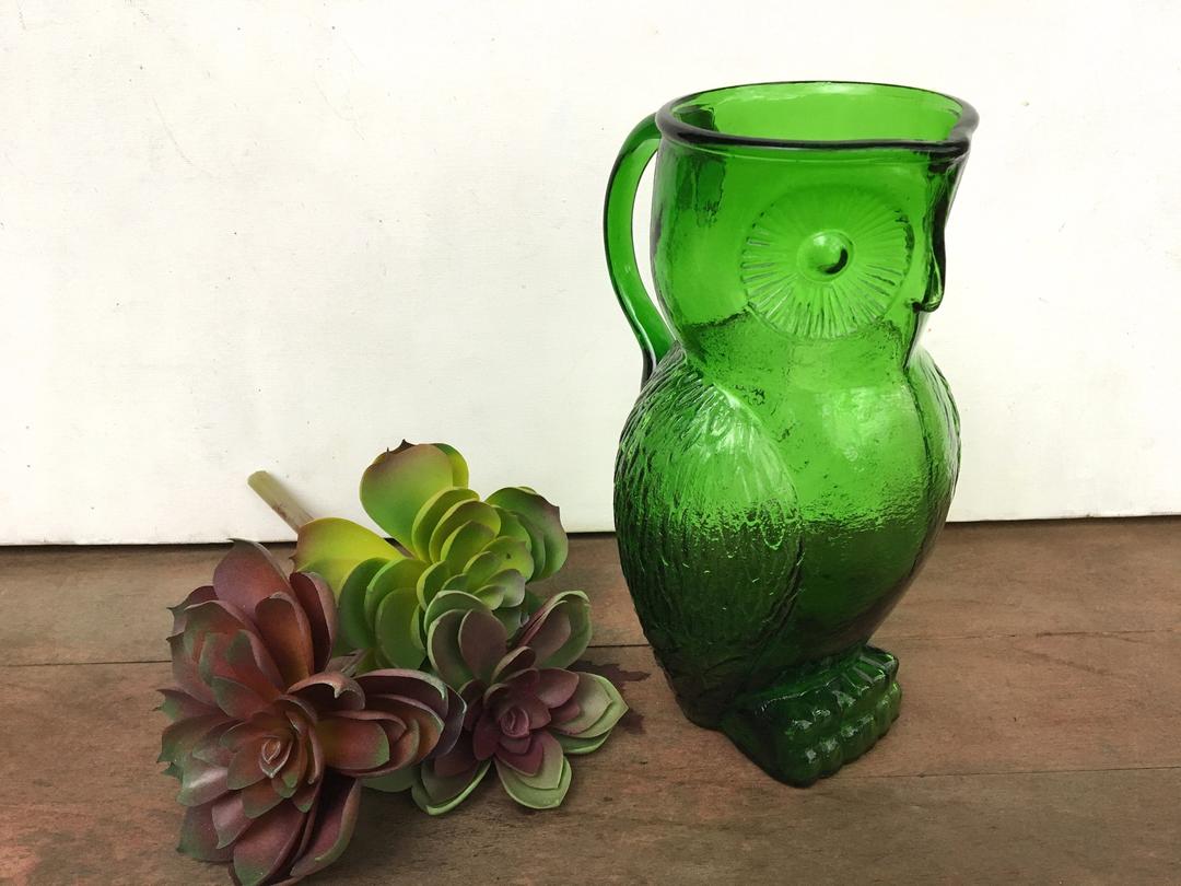 Blue glass owl offers pitcher