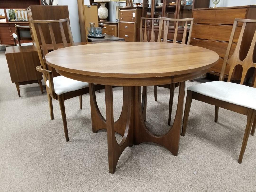 Round dining table from the Brasilia collection by Broyhill Peg Leg