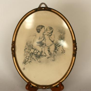 vintage cherub print in oval gilt frame 