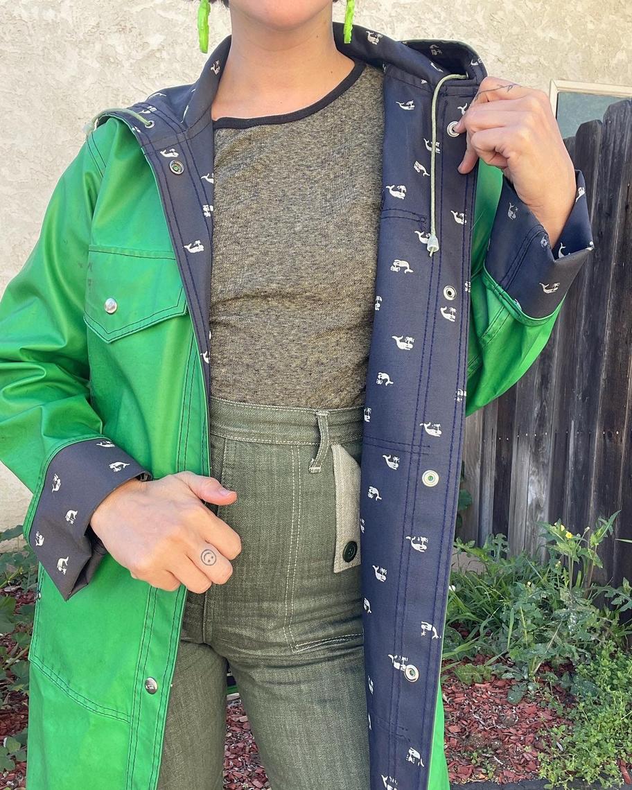 Vintage 70s/80s green rain coat with whales printed on