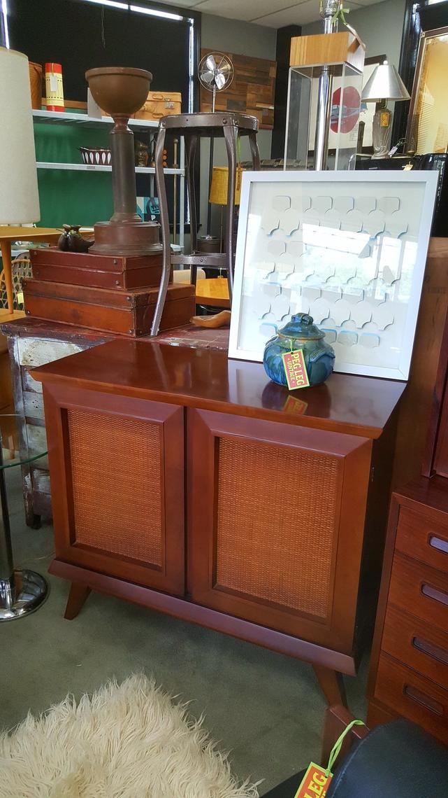 MidCentury Modern smallscale credenza with cane details and walnut finish Peg Leg Vintage
