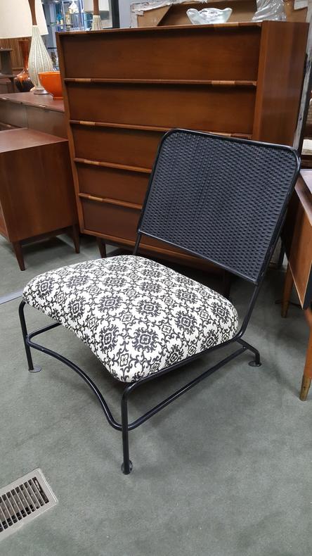 Mid-Century Modern wrought iron chair with woven back and black and white upholstered seat