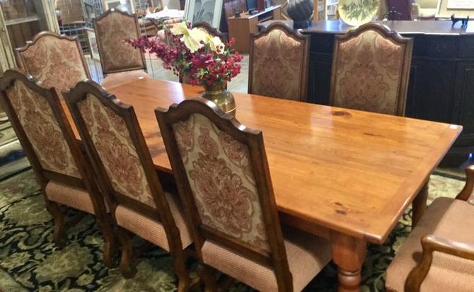 Solid wood table with 8 decorative dining chairs available 