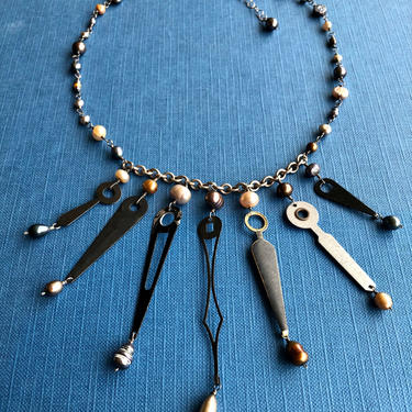 Seven Points in Time [freshwater pearl, sterling silver, clock hands] 