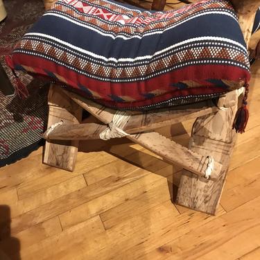 Pair of Camel saddles with pillows.