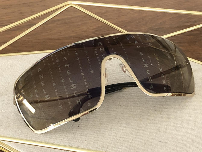 Chanel shield outlet sunglasses gold