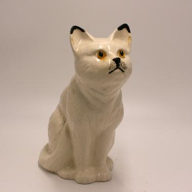 vintage white ceramic cat with yellow eyes 