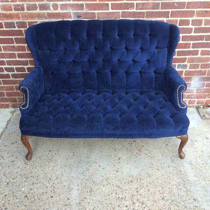 Elegant, tufted blue velvet love seat. from Off the Beaten Track