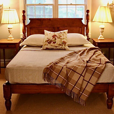 Ball & Bell high-low style bed in tiger maple. Queen size w/ chamfered roll-back raised paneled headboard