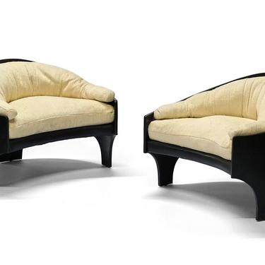 A pair of Henry P Glass intimate island lounge chairs 