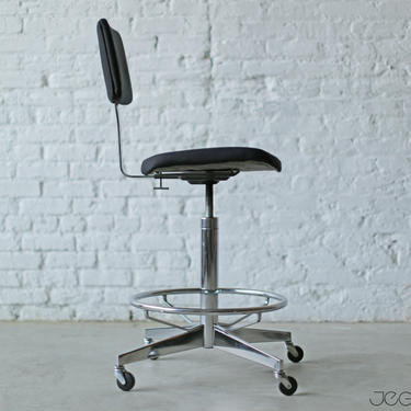 mid-century modern deep blue and chrome rolling drafting stool by Steelcase, height and back height adjustable 