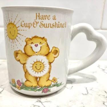 Vintage Circa 1983 &amp;quot;Have a Cup O'Sunshine&amp;quot; Yellow Care Bear Heart Handle Mug by LeChalet