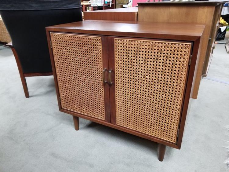 MidCentury Modern walnut with rattan door fronts Peg Leg