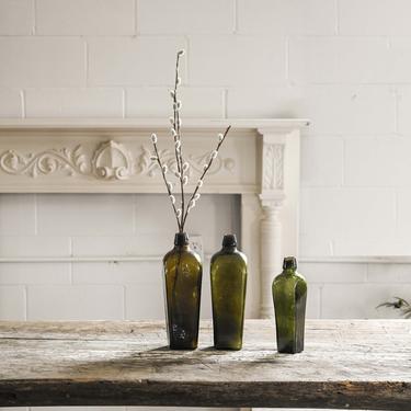 vintage green glass gin bottles