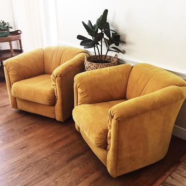 Pair of mid century mustard lounge chairs on casters, two lounge chairs on casters, vintage barrel chairs on casters 