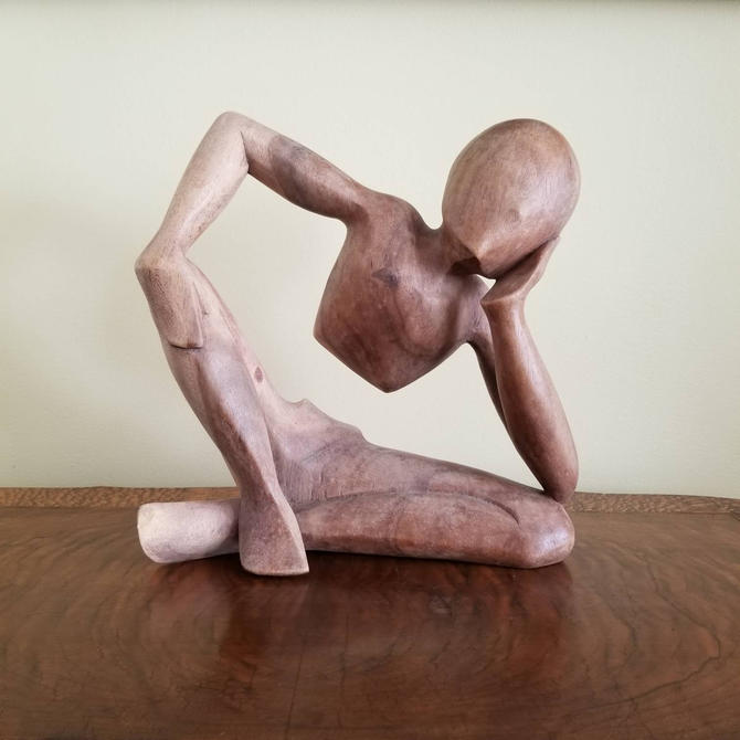 Abstract Wood Sculpture of Man Sitting Down with a Book - Thinker