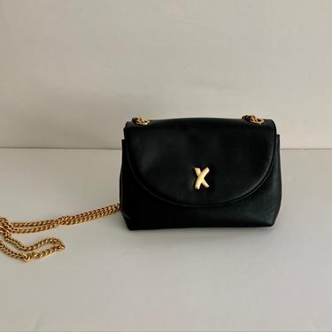Paloma Picasso black leather crossbody small flap bag w/ signature X clasp 