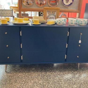 Navy painted mid century dresser. 9 drawers, silver feet!  60” x 19.5” x 31.5”