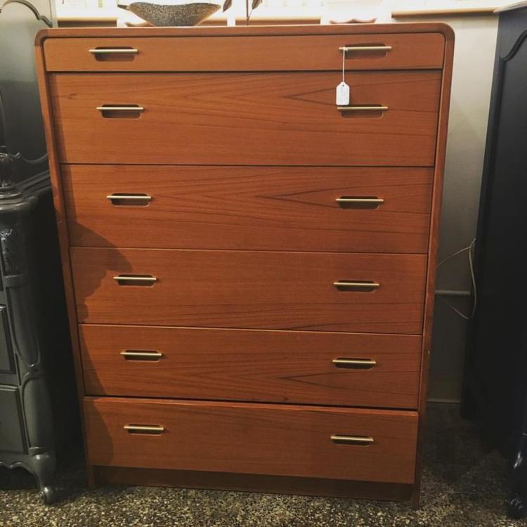 Teak chest of drawers with brass look pulls. $695. 36.5 inches wide, 48.5 inches tall, 18 inches deep.