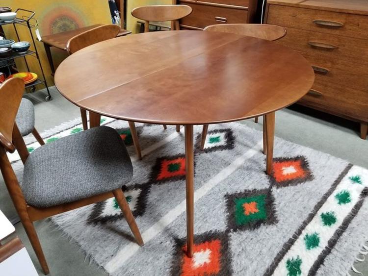 Mid-Century Modern round dining table with two 12"leaves by Conant Ball