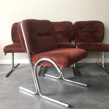 set of 4 vintage mid century modern chrome cantilever chairs.