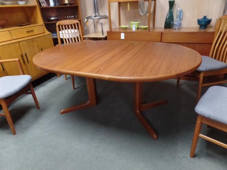 Danish Modern teak round pedestal dining table with two 20" leaves