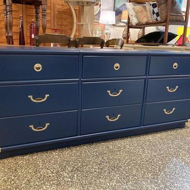 Long low blue painted campaign style dresser by Drexel.  70.5” x 19” x 29”