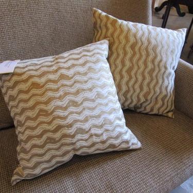 PAIR OF GOLD AND CREAM PILLOWS