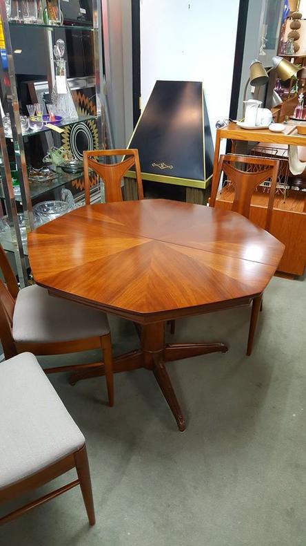 Mid-Century Modern octagonal walnut dining table with one leaf. Peg Leg Vintage.