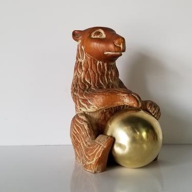 Late 20th Century Sarreid Ltd. Carved Wood Sculpture of Bear Holding Brass Ball. 