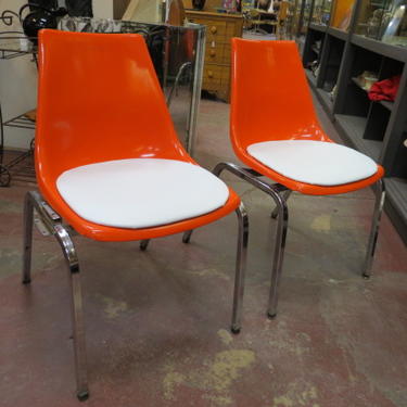 Vintage MCM pair of Orange fiberglass shell chairs
