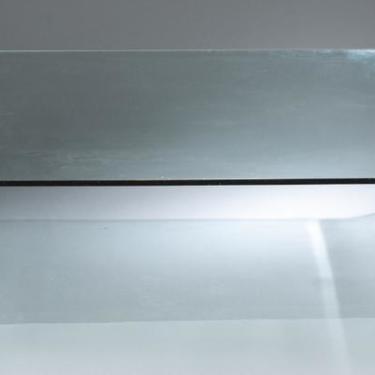 A Mid Century glass rectangular coffee table.