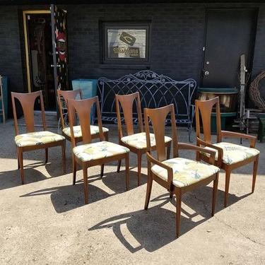 Set of 6 MCM dining chairs. Original fabric is underneath current upholstery. 