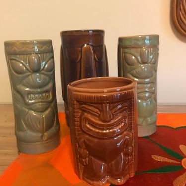 Great collection of four Tiki glasses and coffee mug 